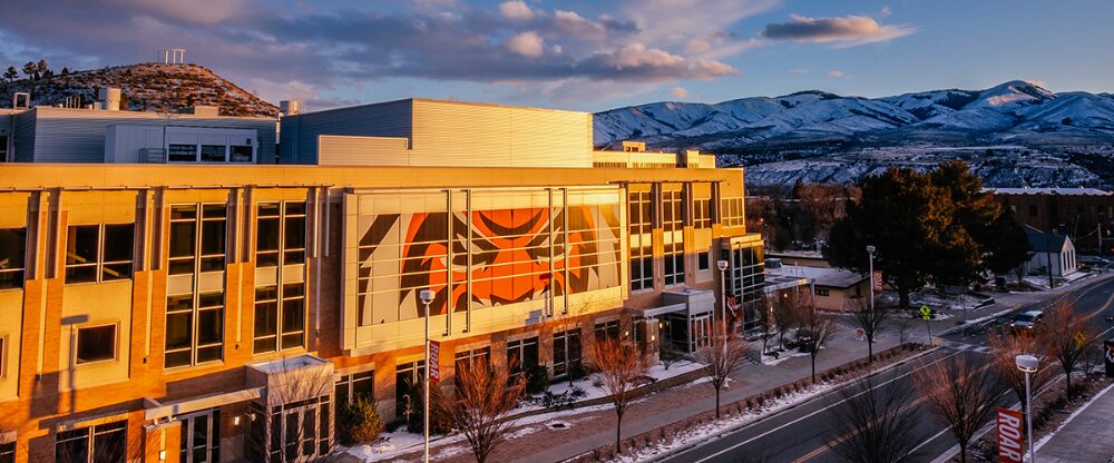 Idaho State University building with mountain scenery