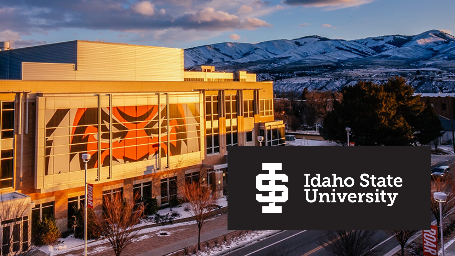 Idaho State University building with mountain scenery in the background